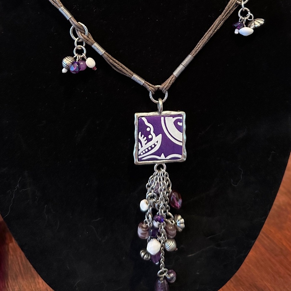 Purple and white necklace and earrings.